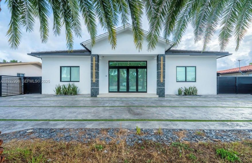 Experience refined Miami living in this custom 2024 residence offering a total of 6 bedrooms/6 bathrooms, thoughtfully designed for luxury, privacy & flexibility. The main home features 5 bedrooms/4 bathrooms with expansive living areas, while fully independent 1 bedroom/1 bath in-law residence with full kitchen provides the perfect solution for multi-generational living. Set on a 10,275 sq ft lot, the property boasts a heated resort-style pool with outdoor pool bathroom, ideal for entertaining year-round. This property with high-end finishes throughout, and exceptional functionality, delivers a rare combination of elegance and versatility in a prime Miami location. Seller is motivated - Schedule your showing today!