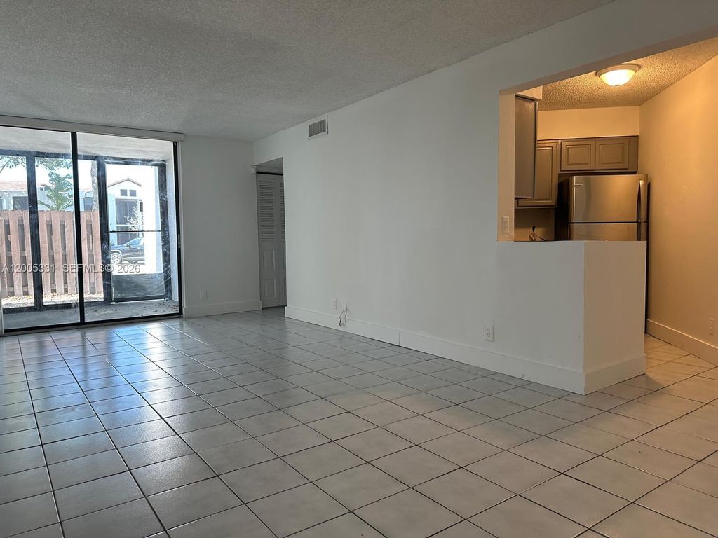 Photo of 215 Lake Pointe Dr #113, Oakland Park, FL 33309 (MLS # A12005331)