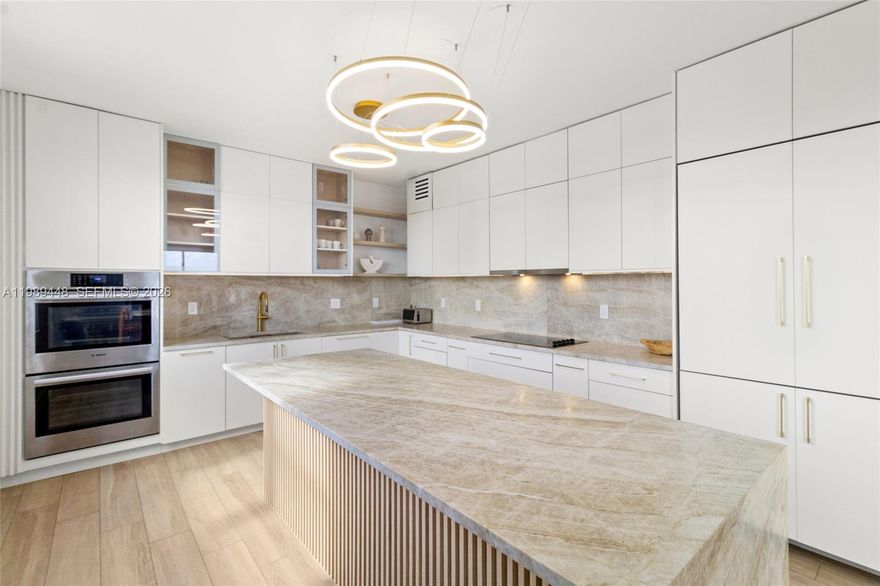 Penthouse residence offering 3 beds, 3.5 baths plus a Den/Office across 2,800+ SF of fully rebuilt electrical, plumbing, mechanical and a redesigned modern layout. Features include formal living and dining, spacious family room, and designer kitchen with leathered quartzite countertops, full backsplash, and luxury appliances. Premium finishes and high-end materials throughout. Panoramic unobstructed ocean views with rare North, South, and Intercostal exposures deliver natural sunlight from every room. A perfect blend to enjoy both an oceanfront and boating lifestyle. Expansive 950 SF private rooftop terrace which creates a seamless indoor-outdoor living. Full-service building in one of Hallandale’s most desirable location with marina/dock access, pool, spa, fitness center, tennis, 24/7 security, 2 covered parking, in-unit washer dryer, large storage, and near Aventura Mall and houses of worship.