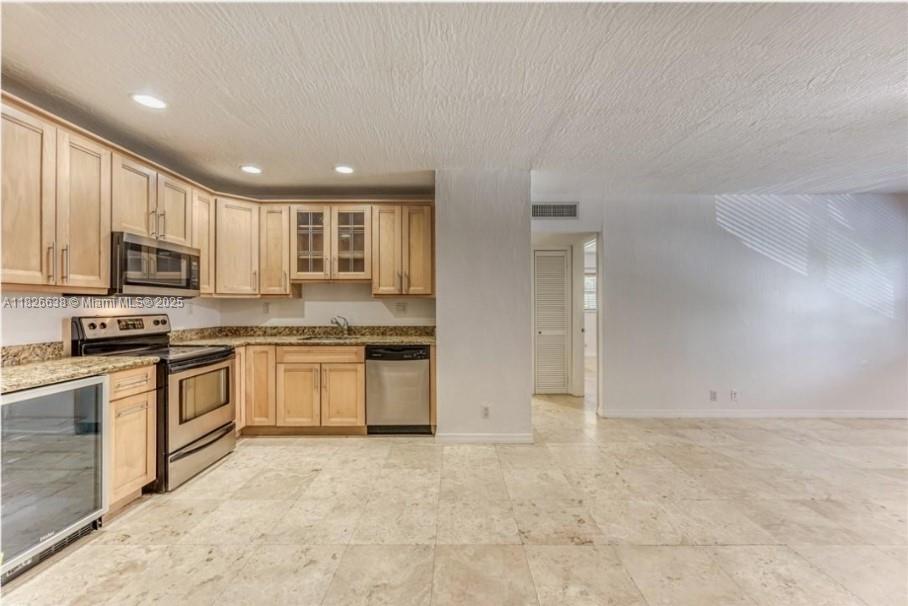 Welcome home to this spacious 2-bedroom, 1-bath condo in the heart of Fort Lauderdale! Located on the 2nd floor, this unit features modern finishes, granite countertops, and a built-in wine cooler—perfect for entertaining. Enjoy the convenience of tandem parking for 2 vehicles and a shared laundry room on site. Just minutes from Flagler Village, Las Olas, and Wilton Drive, you’re close to some of the best dining, shopping, and nightlife Fort Lauderdale has to offer. Don’t miss this opportunity to live in one of the city's most vibrant neighborhoods.