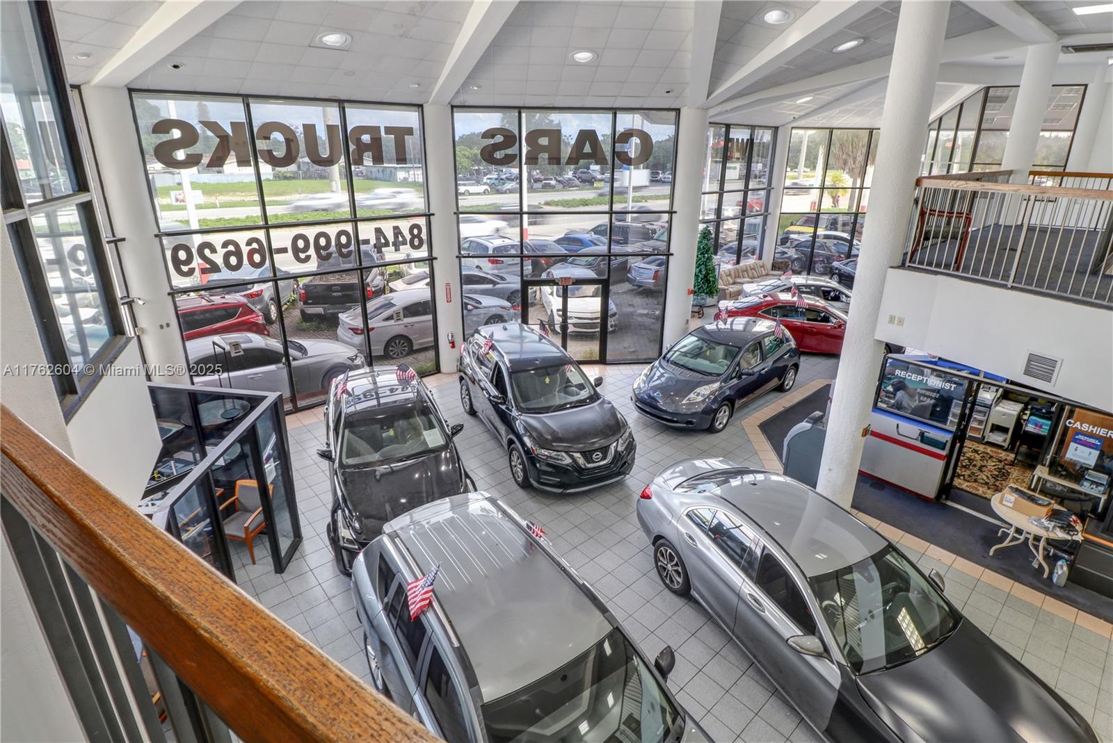 This iconic, 2-story, 41,000 SF dealership, under AC with parking for over 250 vehicles, is designed to accommodate every aspect of an automotive business with impressive functionality. The first floor features a showroom with ample room for vehicle displays, conference room, and financing center for smooth transactions. The building also boasts numerous private offices providing essential space for administration, sales teams, and management to operate efficiently. The property includes a state-of-the-art service center with vehicle lifts and service bays, capable of handling from routine maintenance to more complex repairs. This prime location represents an unmatched opportunity to operate a thriving automotive business in one of South Florida’s most coveted automotive corridors.