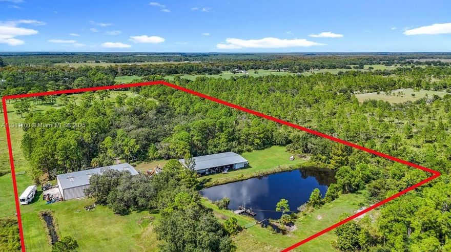 NATURE LOVERS! NATIVE FLORIDA AT ITS VERY BEST! Home plus hangar plus 5,000 SF equipment steel pole barn plus 1,100 SF RV/Boat port! A rare country estate that combines comfortable living and versatility in the peaceful Muse area of LaBelle. This top-of-the-line and custom designed 2004 modular home has 3 bedrooms, 2 baths plus a family room/den, and over 2,400 sq ft of heated living space (3,567 sq ft total under roof). The property’s truly move-in ready—including a new 5-ton A/C system (2025), a new metal roof (2024), and a 20 KW Generac whole-home generator for complete peace of mind. A welcoming covered front porch (15' × 26') sets the tone, leading into a bright ceramic-tiled foyer and a spacious, open interior.