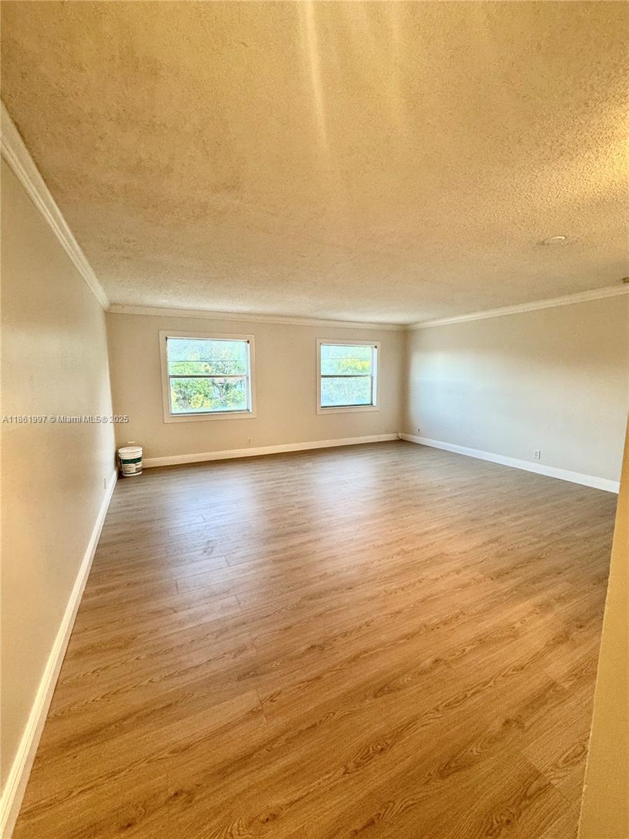 Step into this beautiful and inviting 2-bedroom, 2-bathroom corner unit, offering one of the largest floor plans in the building. Enjoy a warm and cozy atmosphere with laminated wood flooring throughout and a spacious walk-in closet. This comfortable home is perfectly located just around the corner from Downtown Hollywood, where you’ll find a variety of great restaurants, shops, and a Publix within walking distance. Plus, you're only 10 minutes away from the stunning Hollywood Beach! The building offers, a refreshing pool, laundry facilities, and one assigned parking space. Don’t miss out on this amazing opportunity to enjoy South Florida living at its best!