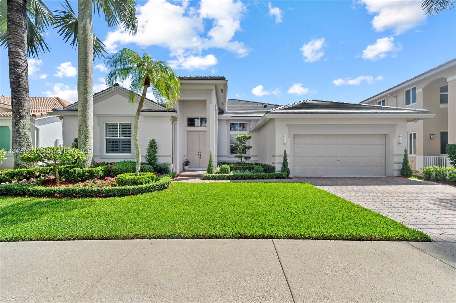 Nestled on a royal-palm cul-de-sac in gated Weston Hills Country Club, this fully renovated 4-bed and den, 3.5-bath single-story residence lives like new. A 2024 flat-tile roof, 2025 HVAC, and fresh landscaping deliver true turnkey ease. Italian tile stretches through open living areas while warm wood floors enrich each bedroom. The chef’s kitchen shines with quartz counters, stainless appliances, an island, and sleek cabinetry. All baths are updated; the primary suite spoils with a sitting area, dual walk-in closets, and a spa-inspired bath. A fully hedged backyard grants total privacy and room to design your dream pool or play space. Stroll to Hunter’s Pointe Park Weston Hills’ only soccer field, plus basketball court and playground just minutes away.