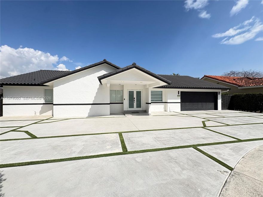 Completely renovated 4-bedroom, 3-bath single-family home located on a quiet semi cul-de-sac in a highly desirable neighborhood of Miami. This beautiful property features an open-concept layout with impressive 14-foot ceilings, a modern Italian-style kitchen with abundant cabinetry and a walk-in pantry, and designer bathrooms throughout. The home includes impact windows and doors, concrete driveway and terrace, and spacious living areas ideal for entertaining. Large backyard with plenty of room for a pool. New aluminum fence installed offering privacy and security. Situated on a generous lot with a 2-car garage and close to major highways, shopping, and A+ schools. A truly move-in-ready home with modern upgrades throughout. No HOA (No Association).