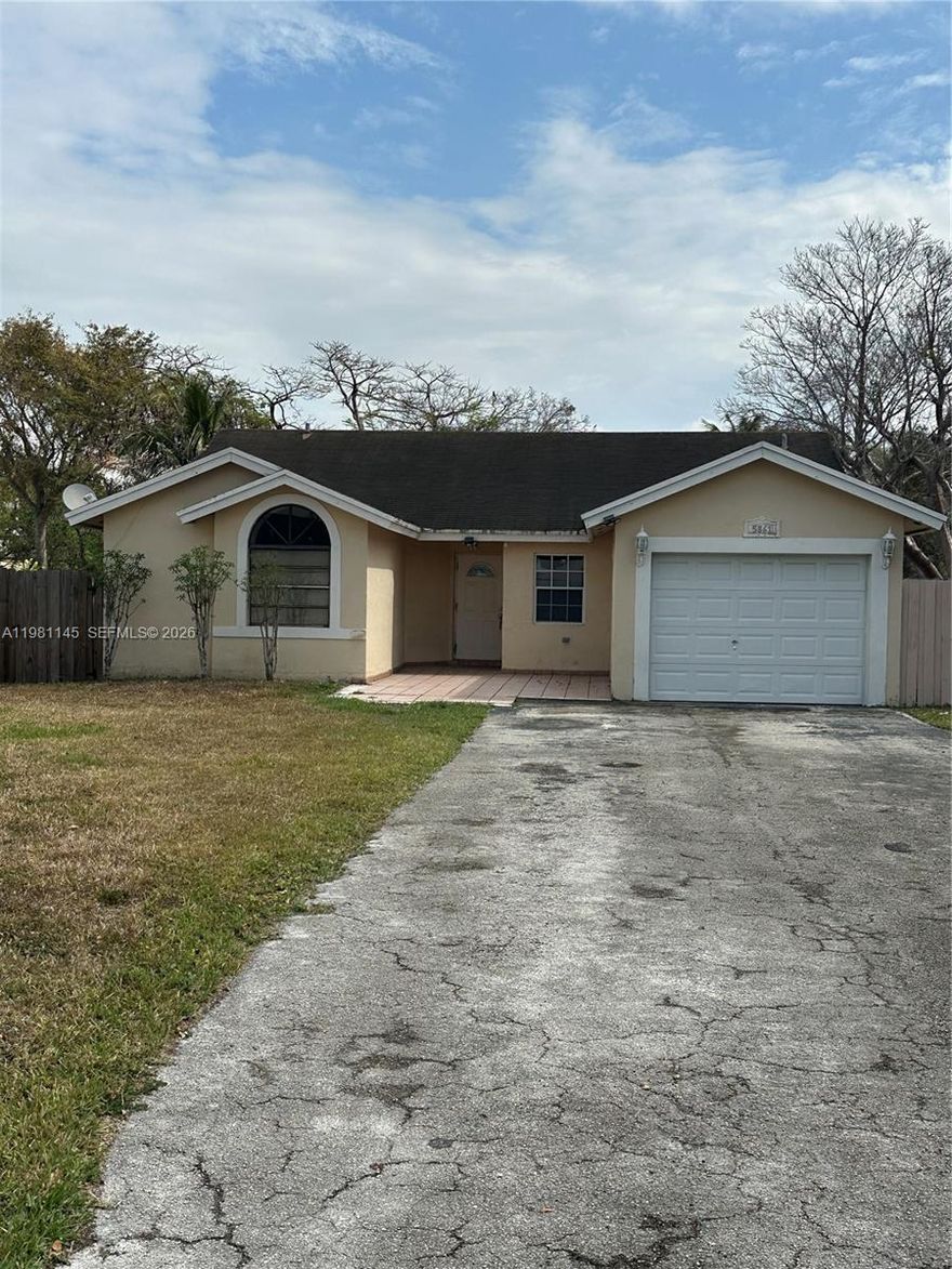 NO HOA!!  A great opportunity to own a 3 bedroom, 2 bath home with a one car garage in the vibrant West Kendall area.  Walking distance to great schools, neighborhood parks, and grocery stores.  Needs some TLC, but home has great bones. High ceilings in living area, tile floor, very bright, and a good sized yard.  Can be a great opportunity for a 1st time home buyer  wanting to get in to a great neighborhood!