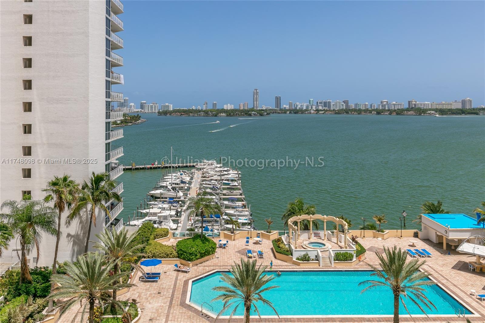 Enjoy magnificent Bay views with this amazing two-bedroom in North Bay Village. Expansive balcony, accessible from all living areas. Split floor plan for peace and tranquility. The kitchen has stainless steel appliances, and marble countertops. *2 assigned parking spots and washer and dryer inside the unit * The building is full of amenities, including 24 hr security, an Olympic-sized swimming pool, Jacuzzi, on-site laundry facilities, stores, gym, hair salon, restaurants, marina and more!