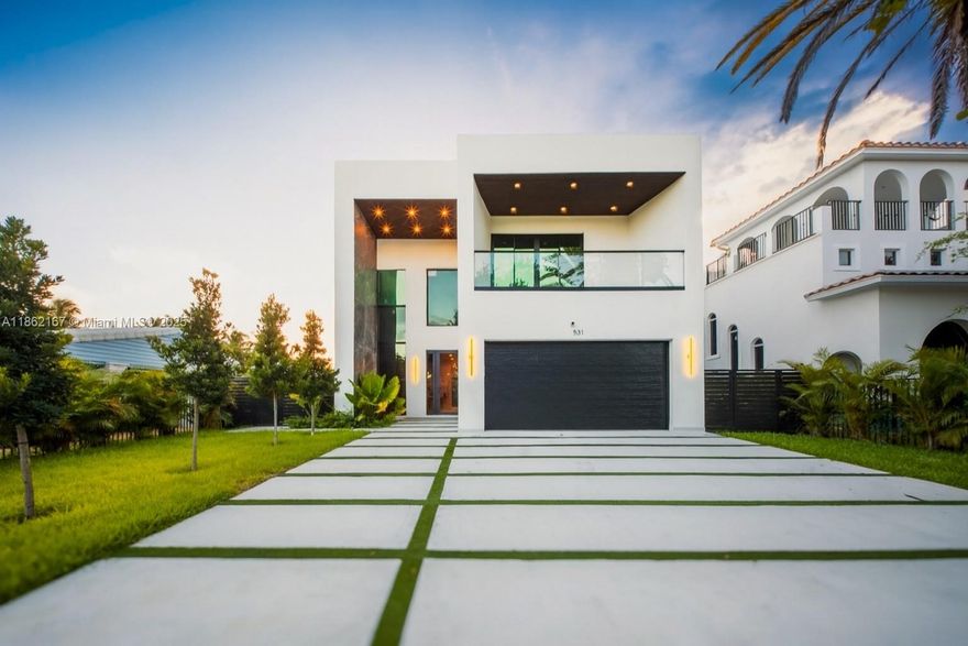 THIS ISN’T JUST ANOTHER NEW CONSTRUCTION—it’s a design-forward lifestyle for the bold, modern, and unapologetically stylish. Located in coveted Victoria Park, mins from Las Olas, the beach & all FTL offers. On a RARE 8,100 SF lot, you're greeted by a 27-ft ceiling and floating oak staircase set against a porcelain-slabbed statement wall—it’s art. The open layout flows into a designer kitchen w/ a 13-ft waterfall island, framed by glass that blurs the line between in & out. Out back: a private resort—heated saltwater pool, spa, summer kitchen & lush landscaping that feels like a permanent vacation. The primary suite is a sanctuary, w/ spa bath, soaking tub, rain shower & curated finishes that whisper luxury. Best part? You’re cruising to dinner, the beach, or your fave café in a golf cart.