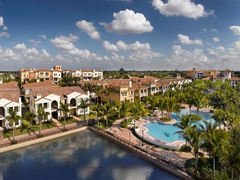 Experience luxury living in this stunning 2-story corner condo, in the exclusive resort-style community of Artesia. This 3-bedroom, 2.5 bathroom home features high ceilings, elegant tile and hardwood floors in living areas, and hardwood floors in bedrooms. The 3rd bedroom is turned into a loft-style office and easily convertible back to a 3rd bedroom. Open balcony w/ peaceful fountain & garden views. Enjoy access to 3 pools, Tennis courts, a Clubhouse w/ a basketball court, billiards, a gym, a sauna, & conference rooms. Conveniently located near major highways, shopping, dining, & Sawgrass Mall, w/ 24-hour security for peace of mind. Just 15 mins to FLL Airport. The building features impact windows and doors, a brand-new roof, fresh paint. $30,000 Assessment has been fully paid off!