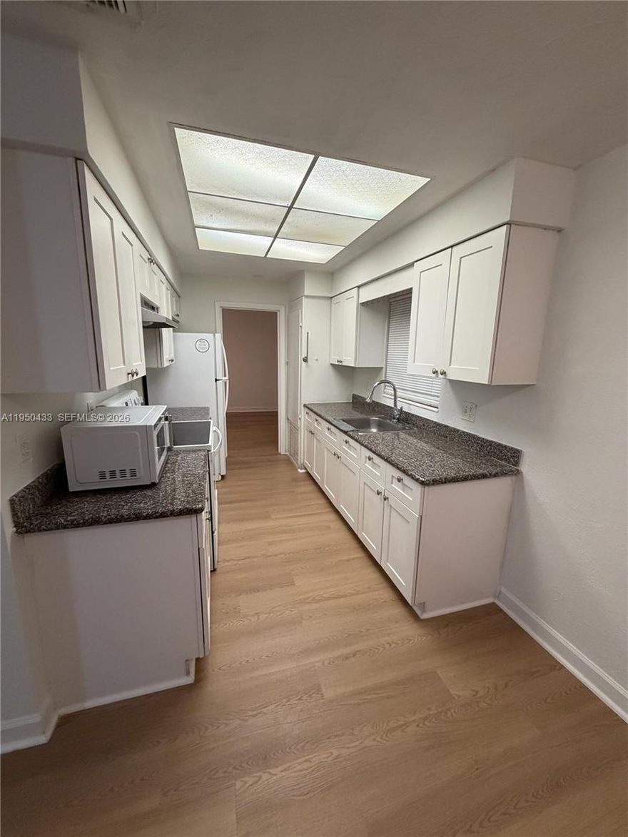 This rare prime investment opportunity offers a spacious duplex on a large expansive lot, featuring two generously sized units—each with 2 comfortable bedrooms and 2 full bathrooms—plus up to 8 dedicated parking spaces that provide a major advantage in high-demand areas, where one unit is already generating steady rental income while the second unit remains vacant, ready for immediate showings, your personal use, or renovations, allowing you to live in one side and rent the other or lease both for maximum cash flow, with plenty of additional land for future enhancements, outdoor enjoyment, or value-adding potential.  Please text me