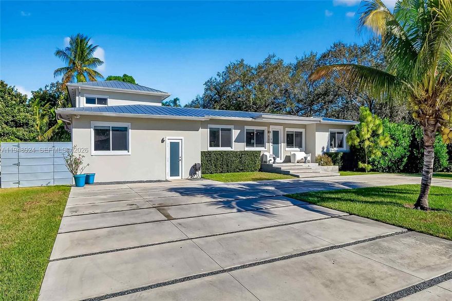 Modern, move-in ready private oasis on an oversized corner lot in the heart of Biscayne Park. This spacious 5-bedroom, 5-full-bath home is thoughtfully designed for active households & everyday living, entertaining, & work-from-home flexibility. The fully fenced backyard is all turf and offers exceptional privacy and space to play, while the large pool, covered patio, outdoor kitchen, and convenient full pool bath create a true indoor-outdoor lifestyle perfect for hosting BBQ’s, pool parties and more. The smart, flexible layout features four bedrooms on the first floor & a private primary retreat occupying the entire second level. The upstairs suite includes a spa-like bath with soaking tub, separate shower, private water closet & a generous walk-in closet, plus extra space ideal for a home office, gym, nursery, or expanded closet. Living areas include a formal living room, expansive family room overlooking the pool and green space, a huge eat-in kitchen with abundant storage & space for a large dining table—perfect for shared meals, homework time, and entertaining friends. Additional highlights include impact windows, upgraded plumbing and electrical, natural gas, full-house generator, indoor laundry room, oversized storage room off the kitchen, and a full workshop, which could be converted for live-in help. Ideally located near museums, parks, gyms & various private schools like Miami Country Day, St. Rose of Lima, Montessori and Cushman. Biscayne Park is the ultimate gem.