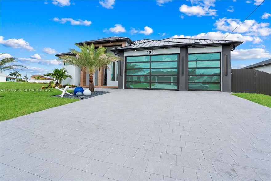 Elevate your lifestyle in this brand-new, ultra-luxury estate at 105 SW 33rd Place, perfectly positioned in the prestigious SW Cape Coral. This 4-bedroom, 3-bathroom masterpiece spans nearly 2,400 sq ft of impeccably designed living space, where every detail exudes sophistication and modern elegance. Step into soaring ceilings, oversized 48x48 imported porcelain tiles, and 10’ impact glass sliders that bathe the home in natural light. The chef’s kitchen is a work of art, featuring Talmaha quartz countertops, bespoke cabinetry with smart lighting, high-end Italian appliances, and a built-in coffee station. The primary suite offers a private sanctuary with a hidden entry, LED-lit custom walk-in closet, spa-inspired bath with designer finishes, and direct access to your poolside oasis. Outdoors, indulge in a 14x28 pool with in-ground spa, floating steps, ambient LED lighting, built-in outdoor kitchen, and lush tropical landscaping—perfect for entertaining or serene relaxation. Additional features include a 3-car garage, smart home technology, and the peace of mind that all assessments are fully paid. Rarely does a property combine unmatched luxury, turnkey readiness, and an exceptional location near boating, shopping, dining, and top schools. Schedule your private showing today and experience Cape Coral living at its absolute finest.