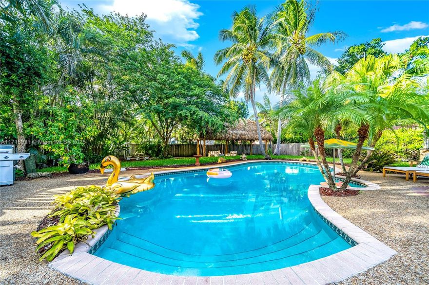 Welcome to your dream home! This stunning 3-bedroom, 2-bathroom residence features a desirable split floor plan, and large bedrooms offering both privacy and spacious living. Outside is your own private oasis—an expansive backyard complete with a heated pool, jacuzzi, and a charming tiki hut, ideal for year-round enjoyment. Situated on a rare double lot, the tropical landscaping enhances the tranquil atmosphere, making it feel like you’re in your own personal resort. Located in a sought-after neighborhood, this home is just minutes away from the beach, the vibrant Wilton Manors, and downtown Fort Lauderdale, where you’ll find restaurants, shops, and entertainment. You’ll love the perfect blend of privacy, luxury, and convenience that this home offers—also could be an amazing AirBnB!