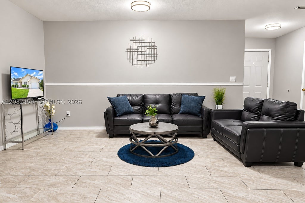 Photo of 722 SE Thanksgiving Ave, Port St Lucie, FL 34984 (MLS # A12082459)