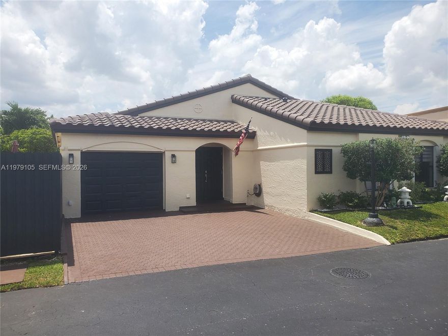 NEW ROOF! | Spacious Covered Terrace | Prime Miami Location Welcome to this beautiful home located in the highly desirable gated community of Poinciana Pointe, offering 24-hour guard security and a low HOA of just $130/month, which includes security and lawn service. This stunning one-story residence features 3 bedrooms and 2 bathrooms, with the third bedroom currently configured as a den/family room overlooking the kitchen—easily convertible back to a bedroom if desired. The home boasts tile flooring throughout, high ceilings, and an open-concept kitchen with granite countertops, creating a bright and inviting living space. Additional highlights include central A/C, a 1-car garage, and a spacious paver driveway. Step outside and enjoy true South Florida living with a covered terrace, beautifully landscaped yard, and a fully fenced property offering privacy and comfort—perfect for entertaining or relaxing. Ideally located near top shopping, dining, and major roadways, this home offers both convenience and lifestyle. A MUST SEE!