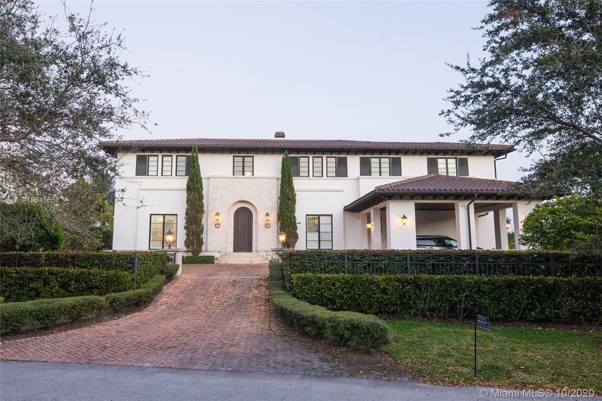 Custom built waterfront Tuscan villa with a modern interior flare, nestled behind the beautiful Mangroves of Matheson Hammock Park. This gorgeous home is located in the exclusive gated community of Hammock Oaks, Coral Gables and boasts a large 20,392 square foot lot and a stunning 8,765 total square foot home with 8 bedrooms and 7.5 bathrooms. First Floor features a gourmet chef kitchen with top of the line Wolf, Miele and Subzero appliances, gas stove and carrera marble countertops. An entertainer's dream, backyard features oversized covered Loggia with outdoor kitchen and large infinity pool. Direct water access with a 55’ boat dock included in price.