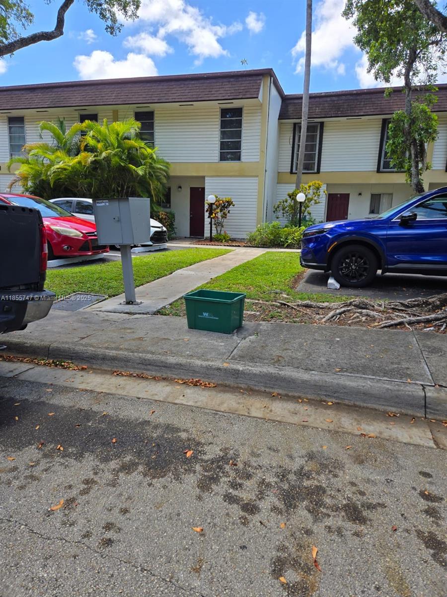 Spacious townhouse featuring 3 bedrooms, 2 full bathrooms, and a half bath, ideally located within walking distance to TY Park, Sheridan Street shopping, and more. This home offers an additional office space, a laundry room, and a fully tiled enclosed patio, perfect as a Florida room. Includes two assigned parking spots plus guest parking. Monthly HOA covers water, sewer, trash, and insurance. Pet-friendly community, with no rental restrictions.