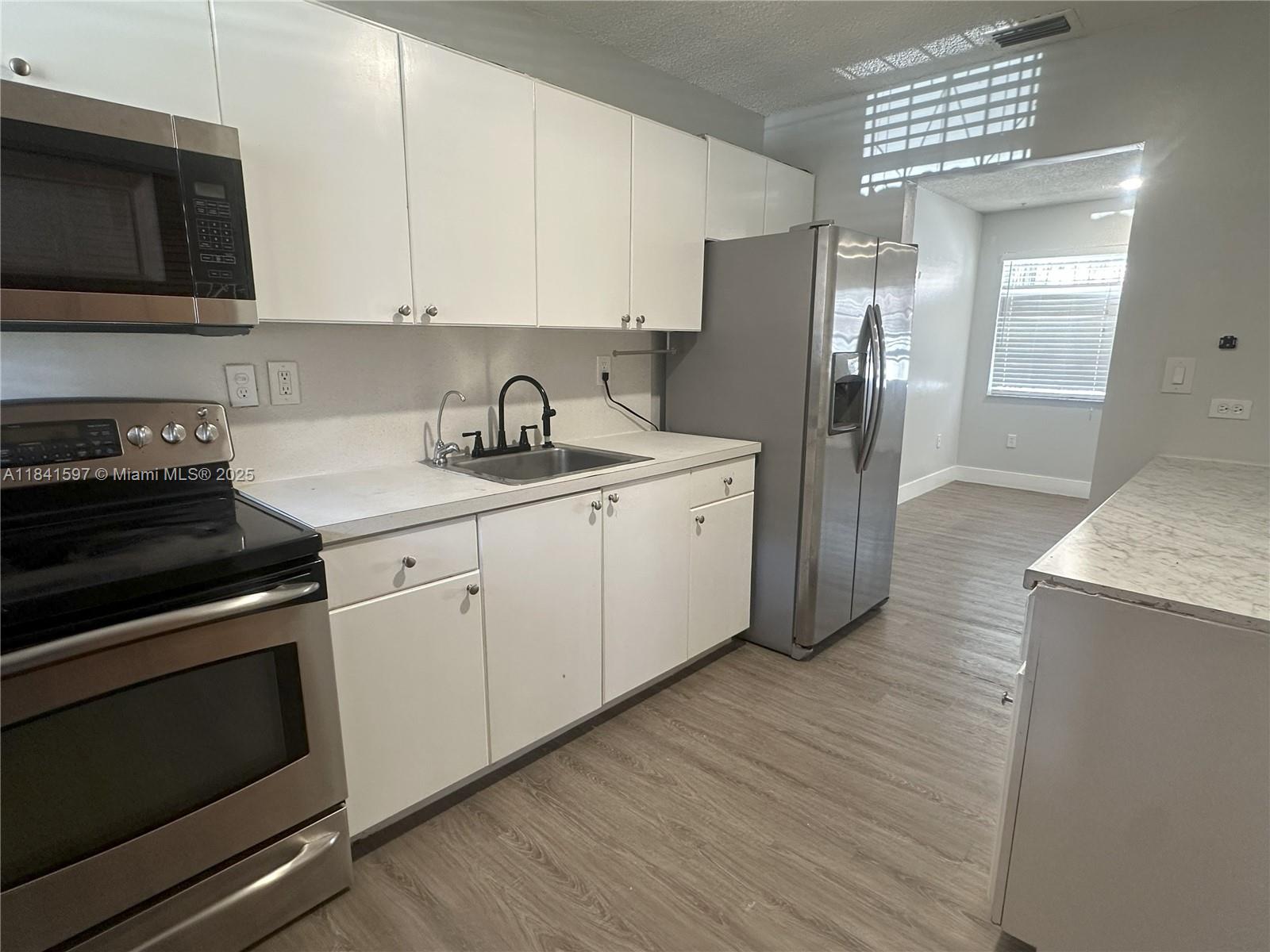 Renovated back unit in duplex with private yard. Great location!