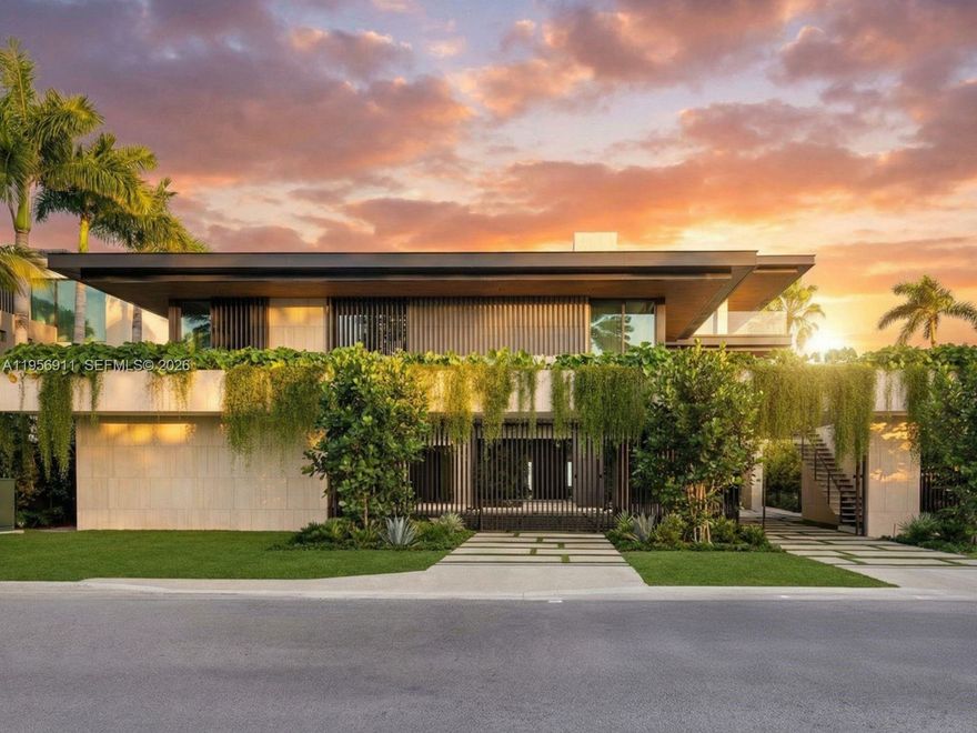 Step Inside With Me! 255 Ocean is the most magnificent modern mansion to ever come to market on the private sands of Golden Beach. Newly completed by TREO and SDH Studio, the façade is draped in greenery and natural stone with no stucco in site. Experience 23’ ceilings upon arrival, a sculptural travertine staircase, and infinite ocean views. Book-matched travertine floors echo the organic movement of the sand. White oak millwork and paneled walls exclusively by La Dolce Vita introduces Italian craftsmanship at every turn. The hosting spaces unfold seamlessly from the beachside entertainment level to the formal salon with centerpiece marble bar, and the ultimate upstairs media room. The oceanfront kitchen showcases monolithic curved islands, Dornbracht fixtures, a breakfast TV lounge, and chef's kitchen. The primary suite is clad in warm oak featuring dual dressing rooms, a hand-carved soaking tub sculpted from a single block of stone and a nearby office suite. Designed for longevity, wellness is woven throughout - fitness studio, massage room, sauna, cold plunge, and enhanced air quality. Outdoors, a 75’ lap pool pairs with an oversized jacuzzi, while the rooftop offers an additional pool and spa overlooking the beach. More highlights include a theater, dedicated office, guest house, 2 elevators, staff room, garage, carport and motor court. Contemporary yet warm, tropical yet refined, this home is designed not just to be admired, but to be lived in. Furnished by Minotti.