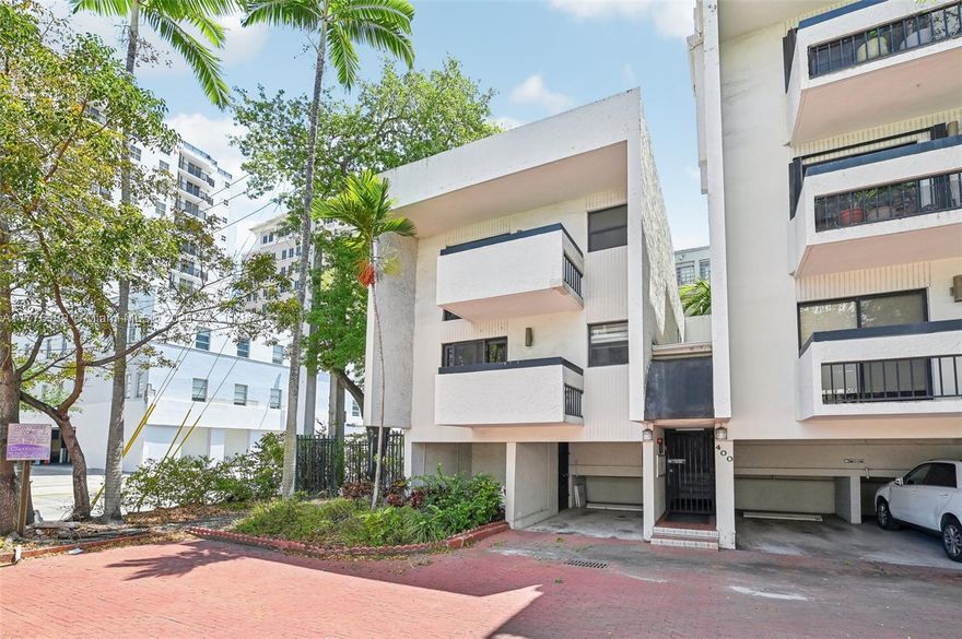 Experience the charm and convenience of Coral Gables with this unique 2-bedroom, 2.5-bathroom ground-floor MULTILEVEL UNIT, nestled in a boutique 7-unit complex. The private corner location provides ample lighting with several balconies to enjoy the outdoors. Beautiful wide plank hardwood floors welcome you in. Enjoy the spacious, renovated kitchen with wood cabinets and all stainless steel appliances. The unit features all impact windows and sliding doors, plenty of closet space, plus a private outside storage room adjacent to your assigned parking space. Full-size washer/dryer in the unit.