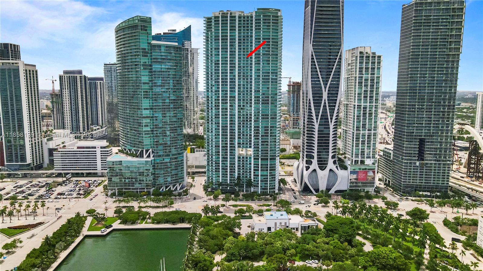 Experience breathtaking bay and city views from this exceptional residence in one of Biscayne Boulevard’s most iconic and uniquely designed buildings. This spacious 2-bedroom+enclosed den with closet offers 3 full baths and an expansive layout with soaring 10-foot floor-to-ceiling windows that flood the space with natural light. Enjoy seamless indoor-outdoor living with 2 oversized terraces offering both East and West exposures. The Italian-designed kitchen is equipped with premium Sub-Zero and Miele appliances. Indulge in resort-style amenities including temperature-controlled pools, a full-service spa with jacuzzi, sauna, steam room, locker rooms, a state-of-the-art fitness center, and an in-house movie theater. In the heart of Miami’s cultural and entertainment corridor.