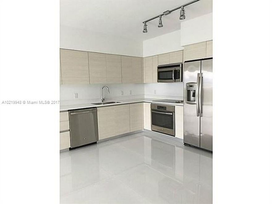 Recent building.  1 bed plus den unit @chic Baltus House! Top notch upgrades, including beautiful white porcelain tile flooring & finished closets. Awesome direct bay view as soon as you open the front door! Great amenities with a huge pool, deck, spa, barbecue area, and a rooftop lounge with an additional pool. Be part of the new "IT" neighborhood in the city. 5' walk  to artsy, elegant, unique Design District, Art Basel front row. Privacy & location, the best!