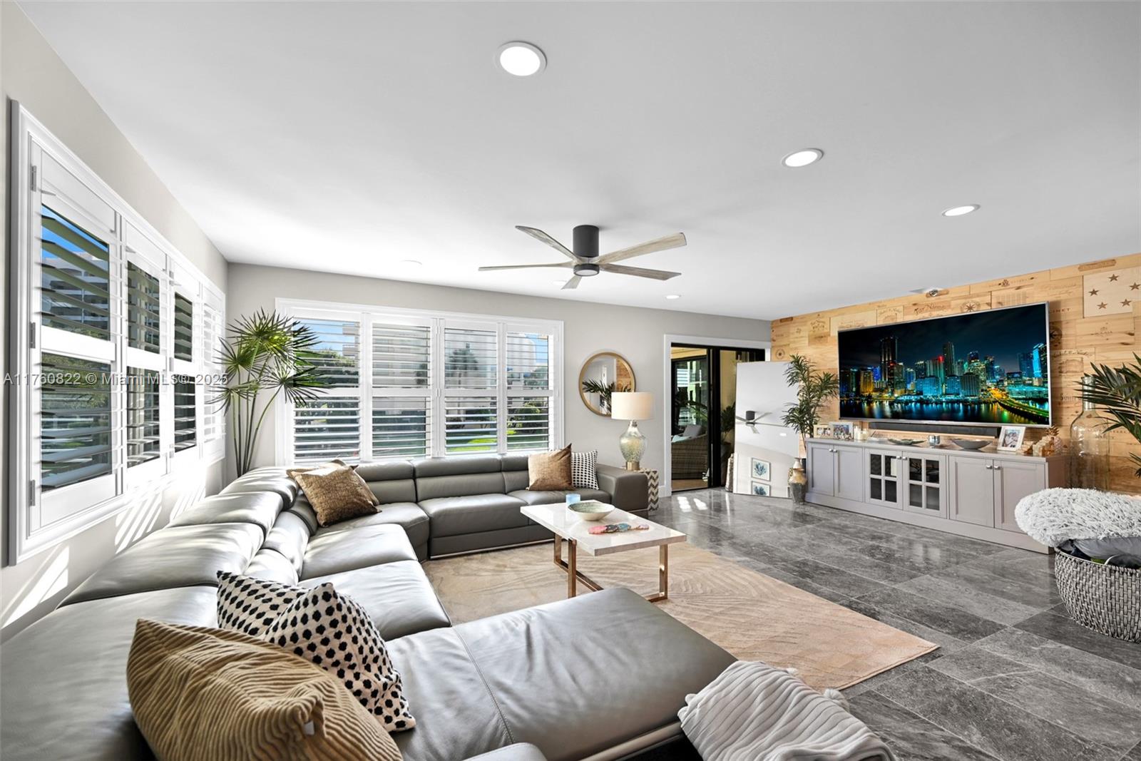 This beautifully remodeled 3-bedroom, 2-bathroom condo offers an exquisite blend of luxury and comfort. The open-concept floor plan creates a seamless flow throughout the home, featuring a stunning waterfall wet bar and a large wine fridge, perfect for both relaxation and entertaining. The kitchen is a true highlight, offering ample cabinetry and a generous space designed for cooking and hosting with ease.Large impact windows, The master bedroom is a serene retreat, complete with spacious his and hers walk-in closets, a dual sink vanity, a luxurious shower with dual showerheads, and a cozy sit-down area. The additional bedrooms are equally impressive, offering ample space and sizable closets.The unit is fully furnished and move-in ready—just bring your suitcase and settle in!