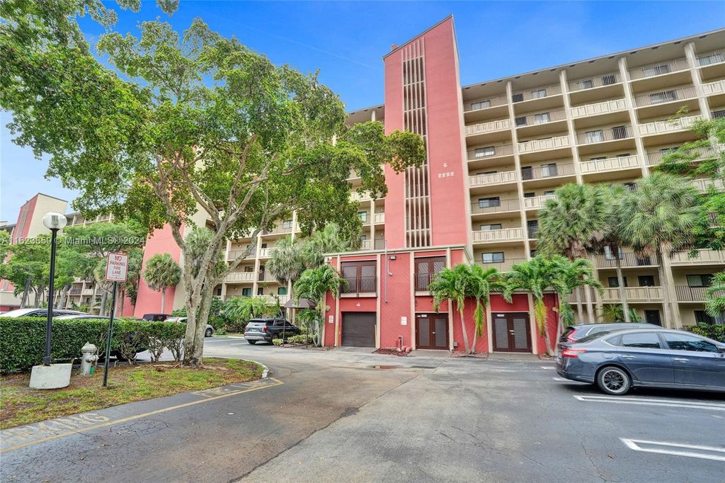 Photo of 2202 S Cypress Bend Dr #402, Pompano Beach, FL 33069 (MLS # A11623850)