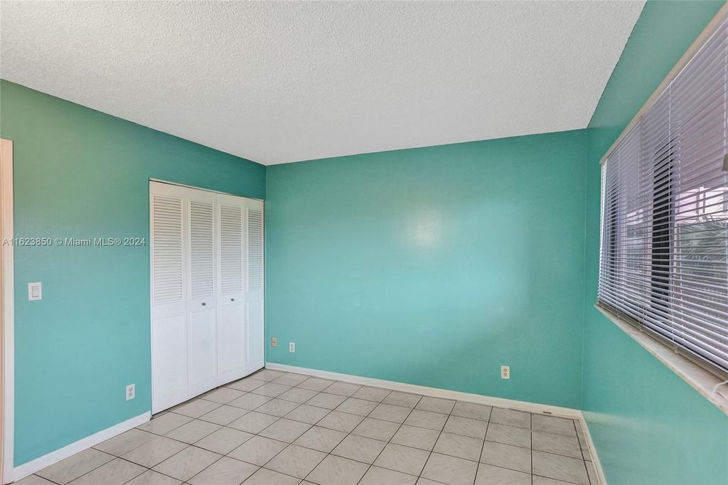 Photo of 2202 S Cypress Bend Dr #402, Pompano Beach, FL 33069 (MLS # A11623850)