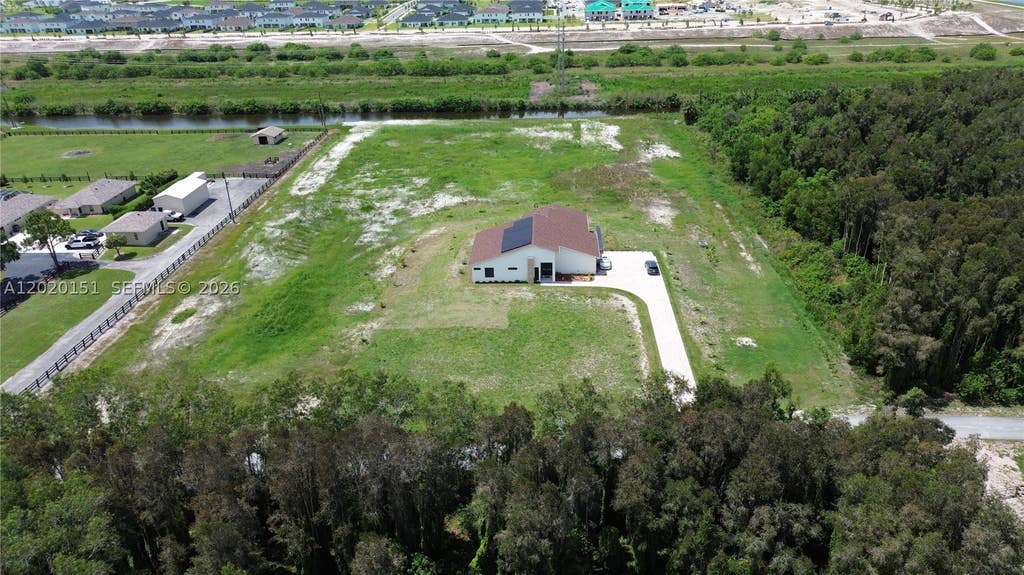 Photo of 19860 Skyhawk Ln, Loxahatchee, FL 33470 (MLS # A12020151)