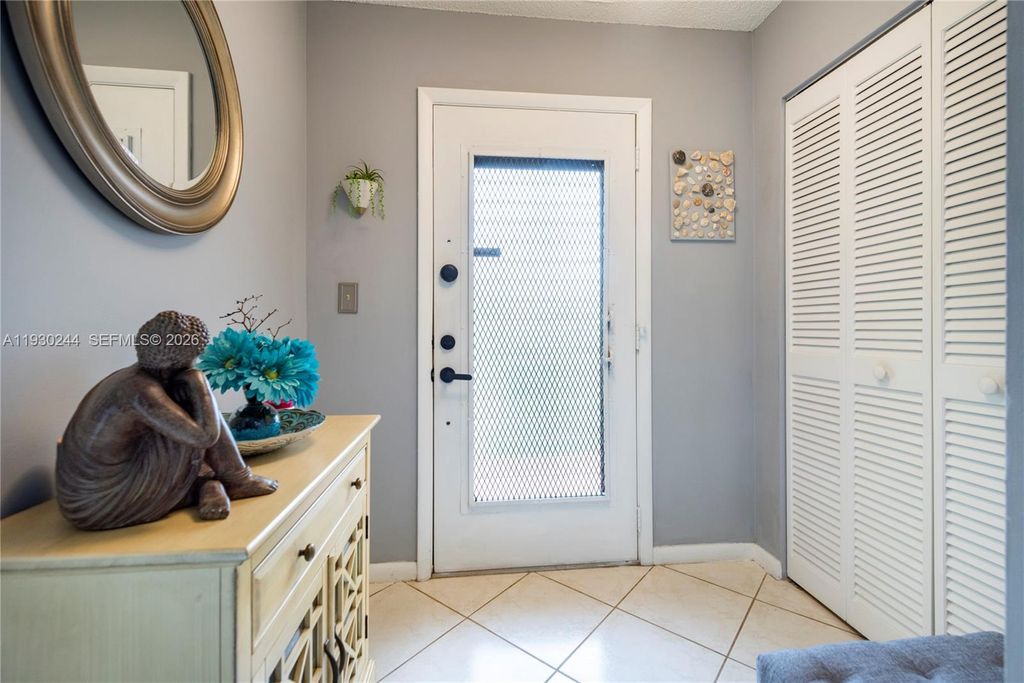 Photo of 4940 E Sabal Palm Blvd #414, Tamarac, FL 33319 (MLS # A11930244)