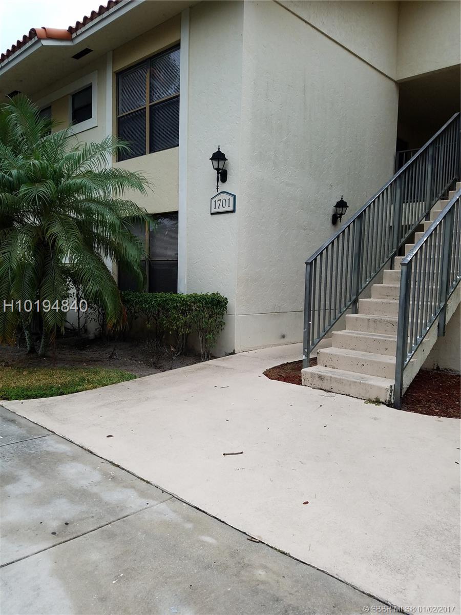 This 2/2 condo is located on the second floor in the desirable community of Palm Beach Place. Kitchen features granite countertops. Canal view from the balcony just off the living room. Split floor plan and washer/dryer located inside of unit. Tile floors in the main living area and carpet in the rooms.
