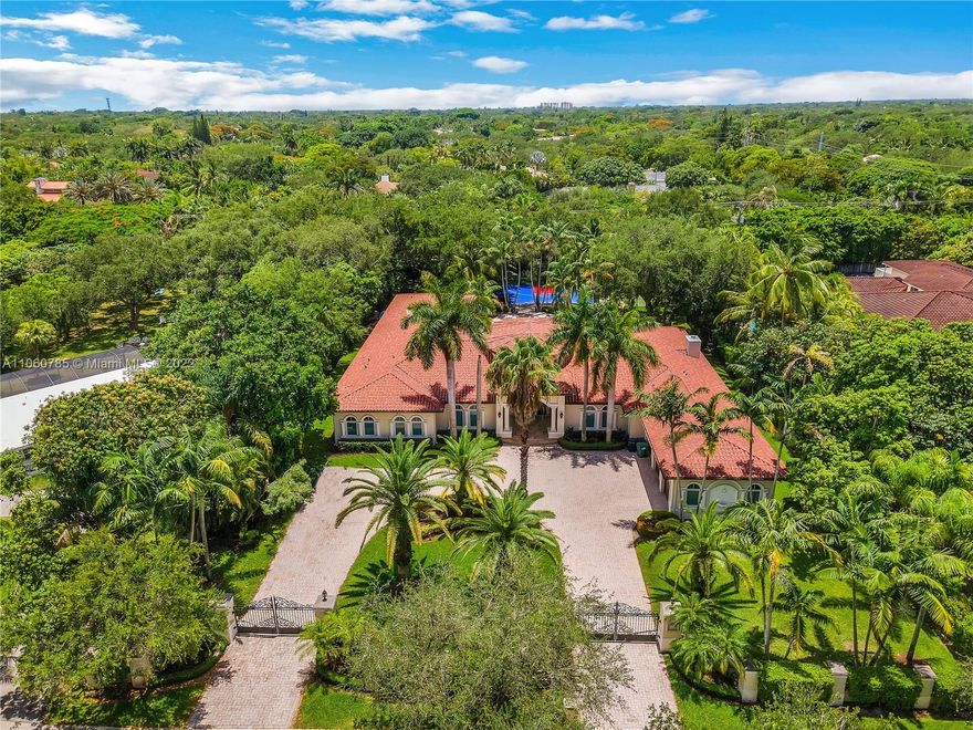 Stunning 1-story home recently remodeled in NE Pinecrest! This home sits on over 1 acre with a half court for the NBA enthusiast. Plenty of privacy with hedges surrounding the property and electric gate at entrance. 3-car garage, 6 bedrooms on one side of the home and an additional service/guest room on the opposite side, laundry room, remodeled kitchen and bathrooms, etc. The perfect home for a large family that wants to be minutes from the best schools Miami has to offer.