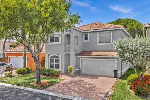 Photo of 7654 NW 21st Dr, Pembroke Pines, FL 33024 (MLS # A12072175)