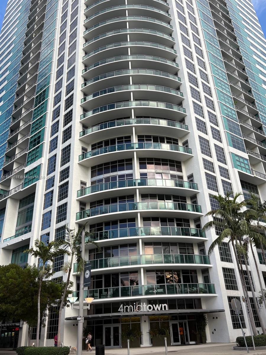 Two story modern loft in the heart of Midtown. Spacious interior allows for easy conversion into a 2 or 3 bedroom layout. The unit is located in building Midtown4. High ceilings, exposed concrete, floor to ceiling windows. The unit has 1,490sq feet of living space. There is a good size balcony facing North. There are two large full bathrooms, one in each floor. Very large closet and new washer and dryer units in a separate closet. Brand new porcelain floors across the property. New water heater and new water filtration system that covers the entire apartment. Near shops, restaurants, cafe's and minutes to Wynwood, Design District, Brickell, South Beach. Be a part of the exciting Midtown community.