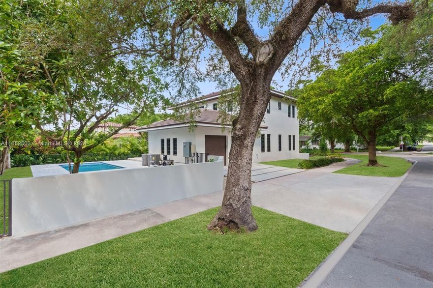 [A Miami Signature Home] Now unveiling this newly-built transitional home in North Gables. Sited on a corner lot under the Gables' verdant canopy, the home features a 2-car garage, pool, and patio—perfect for lounging. The downstairs area includes flowing spaces and a guest bed and bath. Upstairs, the main suite is joined by two additional bedrooms, a hall bath, a laundry room, and a sitting area. Located within walking distance to downtown Coral Gables, residents will enjoy easy access to restaurants, shops, theaters, parks, and recreational facilities. Just a 15-minute drive to MIA, this home is ideal for frequent travelers. New construction at this price point in Coral Gables is rare. Don't miss your chance to acquire this imposing residence in a prime location. Time is of the essence.