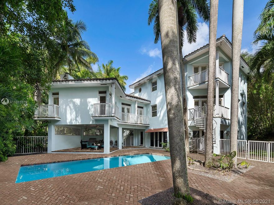 Located along a private, guard gated street in Coconut Grove known as the Anchorage, Reef Haven is a three-story home just a few blocks from Cocowalk with spectacular shopping and dining in the famed heart of the Grove. You enter into the double-height gallery on the main level, offering a cupola with portholes, and as you explore the home you’re presented with over 10 balconies facing every direction. With vaulted ceilings throughout, the 6,000 square foot house offers a variety of gathering spaces, including formal living and dining rooms, a recreation room off the pool and lanai, and an impressively large office. Each space has beautiful light throughout. Renovate or rebuild to create the home of your dreams, and take advantage of the excellent bones the existing house provides.