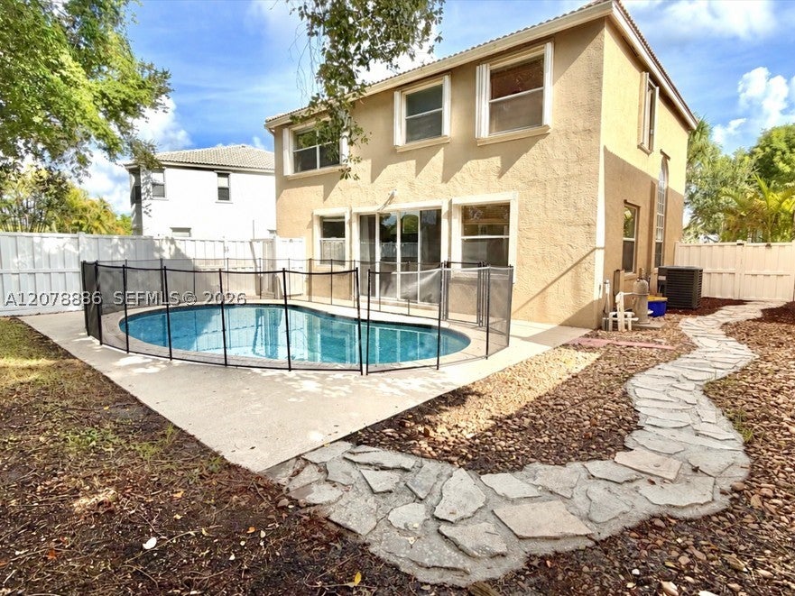 Photo of 1218 Oakwater Dr, Royal Palm Beach, FL 33411 (MLS # A12078886)