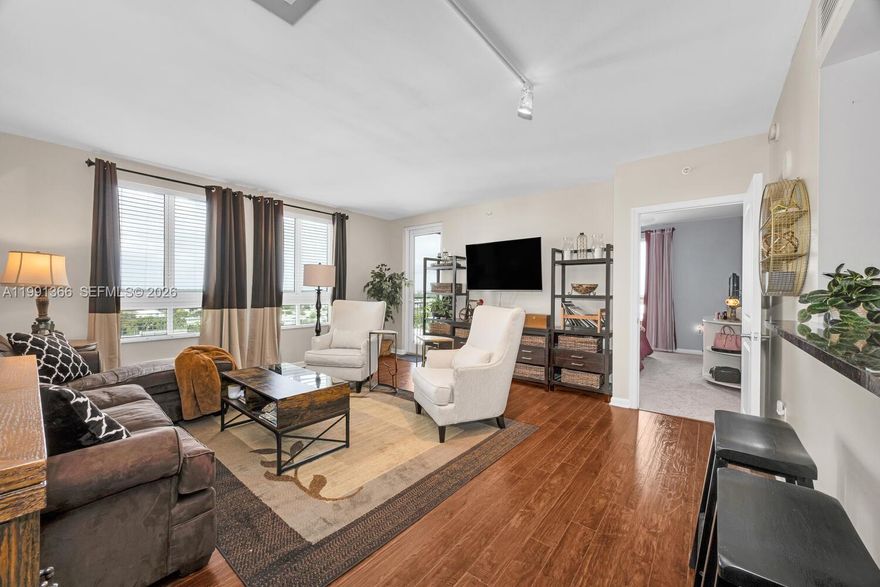 Located in the heart of Dadeland, this beautiful 2-bedroom, 2-bath unit is positioned in the sought after corner line of the Toscano Condominiums. This spacious 1,155 SF residence is offered furnished and features an open-concept living, dining, kitchen layout with wood flooring throughout and abundant natural light. The modern kitchen is equipped with stainless steel appliances, granite countertops, and sleek wood cabinetry, opening seamlessly to a convenient breakfast bar—perfect for casual dining and entertaining. The living and dining areas offer a comfortable flow, ideal for both everyday living and hosting guests.The primary suite is generously sized with a shower/tub combo and walk-in closet, while the second bedroom provides flexibility as a guest room, home office, or home gym. Enjoy a well-designed floor plan with ample storage and convenient hallway laundry room. Enjoy city and sunset views from the private corner balcony off the living room. Includes 1 assigned covered parking space. Building amenities include pool & spa, fitness center, residents club room w. catering kitchen, meditation garden, dog park, valet parking, 24hr security concierge services and more. Prime location just steps from local eateries, Dadeland Mall, and MetroRail station for easy access to UM / downtown Miami. This is a great opportunity to build equity in a highly sought-after building!