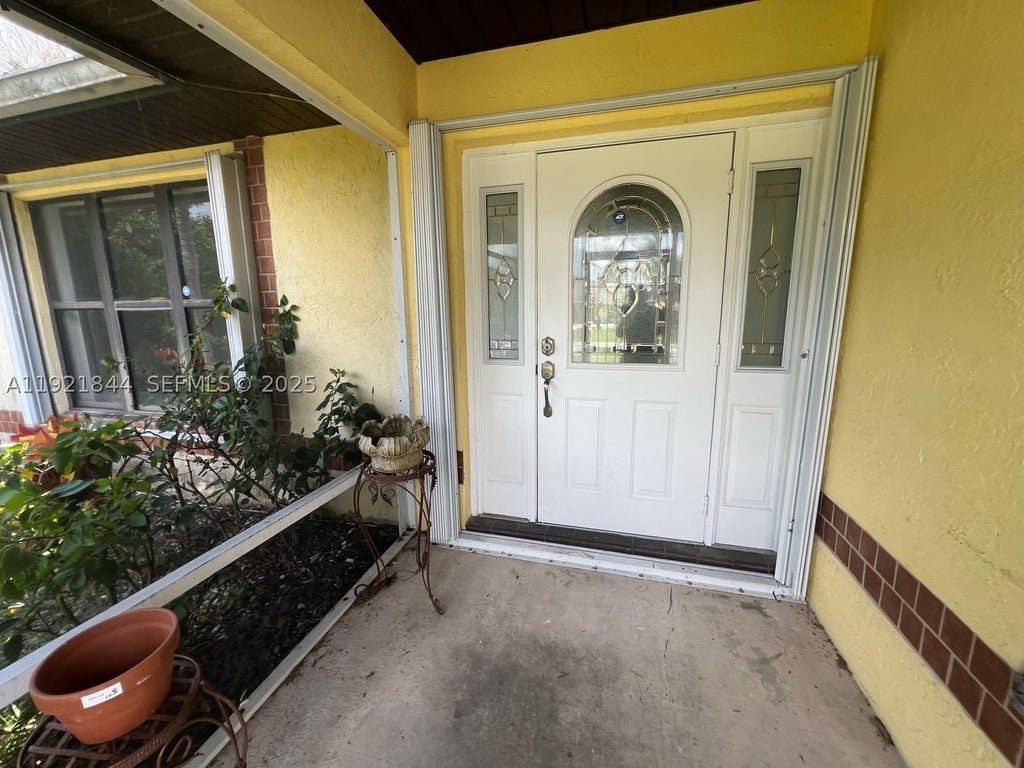 Photo of 2410 SE Renick Ave, Port St Lucie, FL 34952 (MLS # A11921844)
