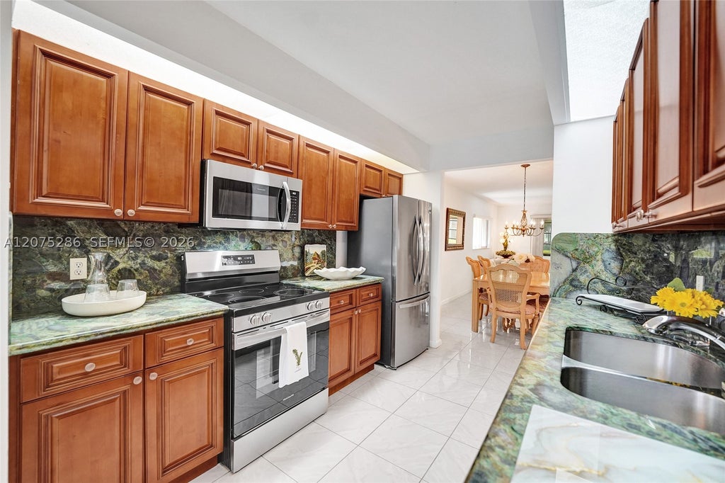 Photo of 800 SW 137th Ave #101G, Pembroke Pines, FL 33027 (MLS # A12075286)