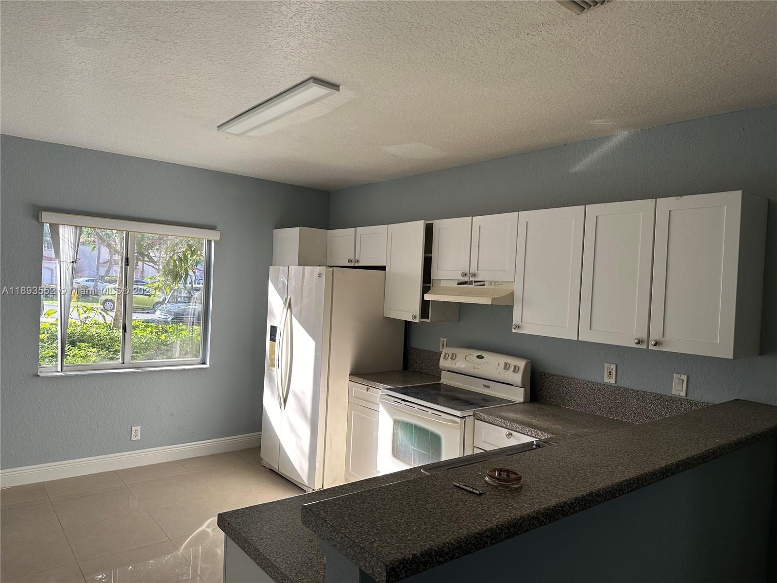 TAMARAC ISLAND CONDOMINIUM - Residential Lease