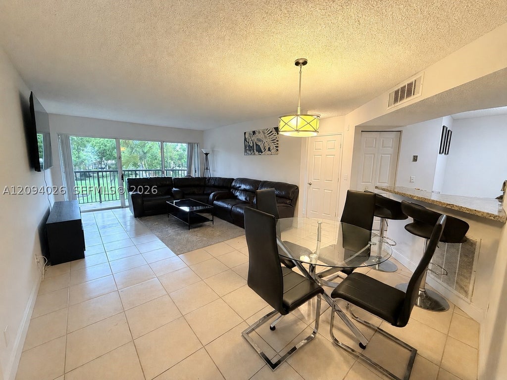 Photo of 8741 Wiles Rd #204, Coral Springs, FL 33067 (MLS # A12094026)