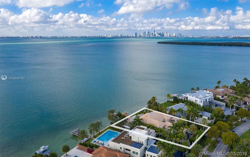 Key Biscayne Magnificent residence with Miami skyline at his best. Built on a over-sized lot (23774 sq.ft). Unique city views. Home offers 8,000+ sq.ft of great amenities and floor plan. Master suite on first floor with expansive own office library . Family room .  4 bedrooms en suite on second floor . Terraces on first and second floor .  Two bedrooms en suite for staff. High ceilings through out the house , large floor to ceiling impact glass windows , large covered terrace embracing the backyard with BBQ area, sitting area and amazing city and pool views.dock  area with boat lift (24000 pounds- 33 plus ft boat ) and dock sitting area. Double stairs circulation . 2 car enclosed garage . Gated . Must visit to appreciate how grand this house is.