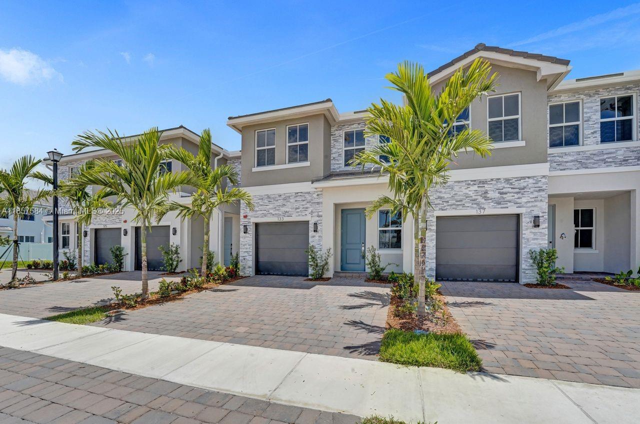 Welcome to Merrick Square, Pembroke Pines’ premier community for modern luxury living. This brand-new 4 bed, 3 bath, 1-car garage home includes a bedroom and full bath on the first floor plus tile throughout. The kitchen boasts 3CM granite countertops, a waterfall island, subway tile backsplash, Whirlpool® stainless steel appliances, and crown molding. The landlord is installing new luxury wood vinyl floors on the second floor—no carpet! Enjoy PVC-fenced yards, frameless shower doors, and impact windows. Professionally landscaped exteriors with paver driveways add curb appeal. The gated community offers a clubhouse, pool, fitness center, and tot lot.