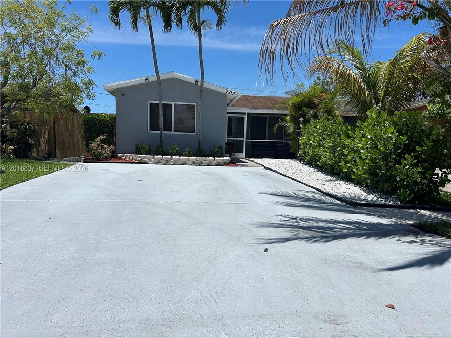 NO HOA!! - Lovely 3 bedroom 2 bathroom home located on a quiet and private street in West Boca. Tiled flooring through, newer bathrooms, A/C, water heater, Appliances and cement patio out back. Just a short ride to restaurants, shopping, Home Depot, Loews, places of worship, and major roadways. This is an opportunity to own a beautiful home in the sandalfoot area. Great investment or a wonderful opportunity to own your own home.