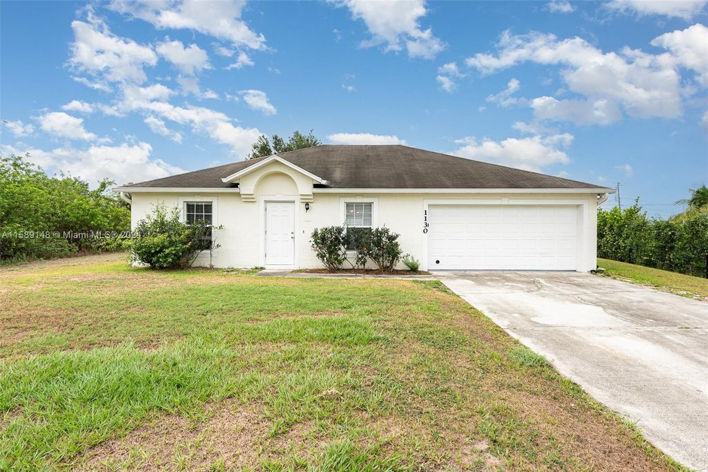 Photo of 1130 SW Kalevala Dr, Port Saint Lucie, FL 34953 (MLS # A11589148)
