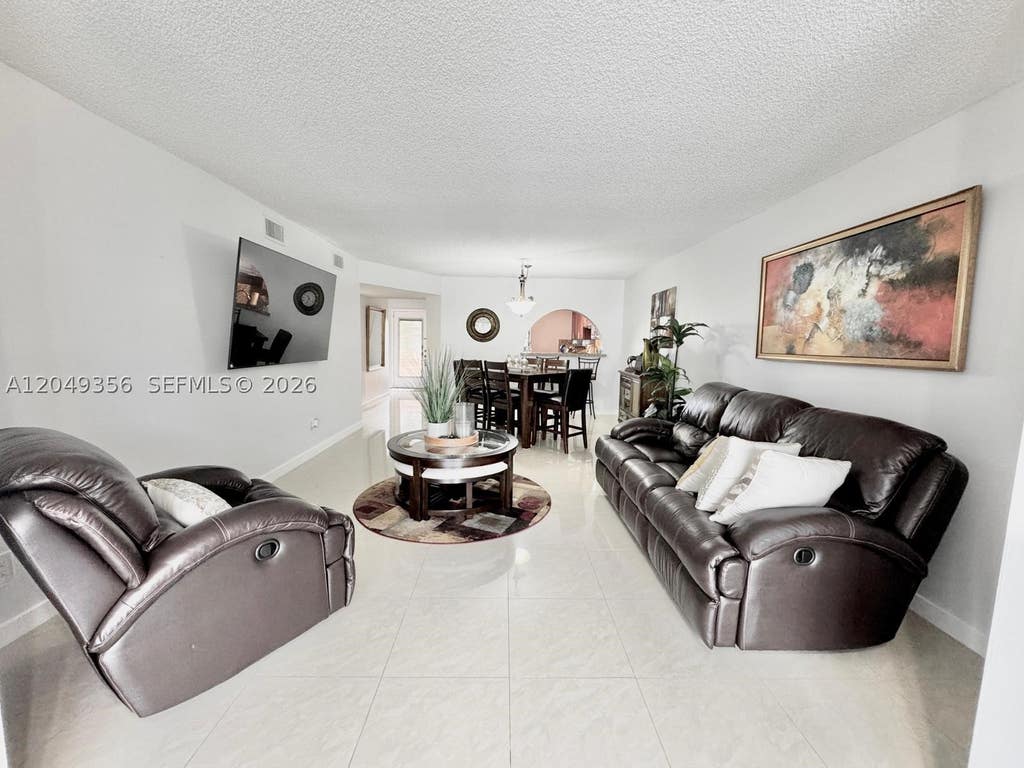 Photo of 4975 E Sabal Palm Blvd #311, Tamarac, FL 33319 (MLS # A12049356)
