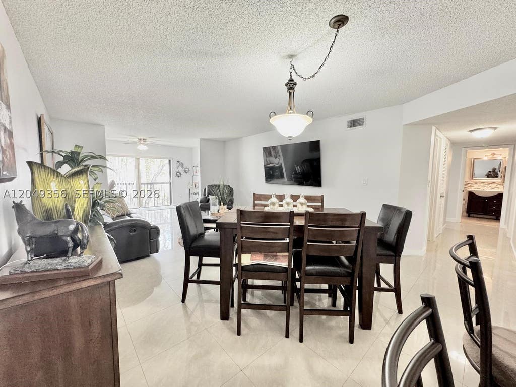 Photo of 4975 E Sabal Palm Blvd #311, Tamarac, FL 33319 (MLS # A12049356)
