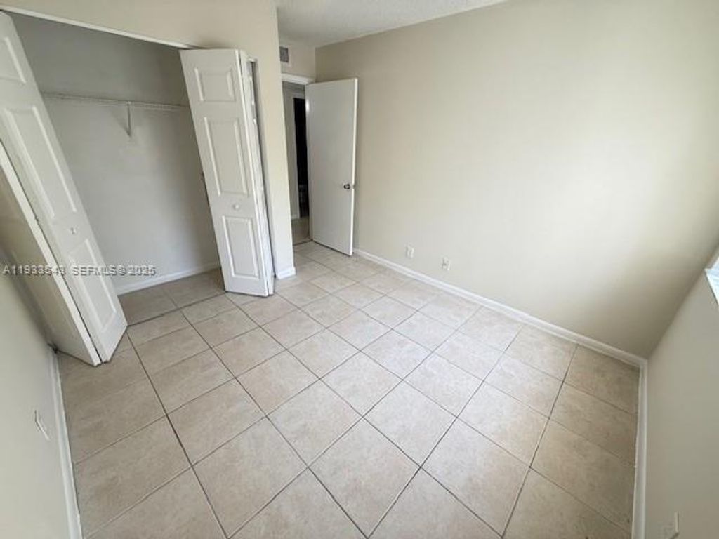 Photo of 10773 Cleary Blvd #201, Plantation, FL 33324 (MLS # A11933543)